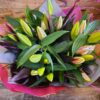 A hand-tied bouquet of top quality pink oriental lilies and lush foliage