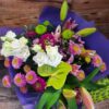 Purples and whites and all things nice! In a hand tied bouquet