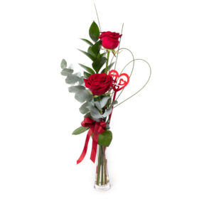 This delightful pairing of gorgeous roses with a contrast of foliage is a perfect gift for that special someone. Lovingly placed in a pretty vase made just for two.
