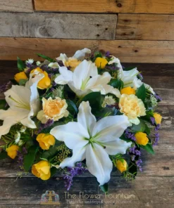 Yellow White and Purple Posy Pad Funeral Tribute | The Flower Fountain | Funeral Flowers Stoke on Trent