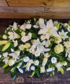 White Lily, Rose and Lisianthus Double Ended Casket Spray - The Flower Fountain Funeral Flowers Stoke on Trent