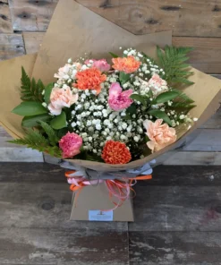 The Carnation One is a soft and timeless bouquet in our “Nice” size. A mix of carnations, gypsophila and foliage. Delivery across Stoke-on-Trent.