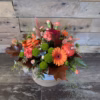 Pumpkin Patch Hatbox with autumn flowers, roses, and gerberas in a stylish kraft hatbox, available for delivery in Stoke-on-Trent.