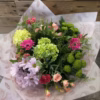 Mother’s Day aqua bouquet in water bubble and gift bag with pink seasonal flowers