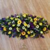 Funeral_Tributes - purple-yellow-and-white-casketspray2
